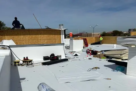 White roof membrane being installed on The Industry Studios, Henderson NV