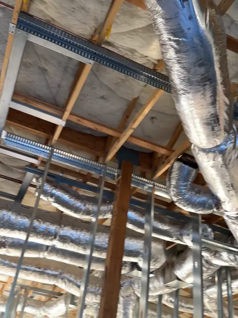 HVAC flex ductwork installed overhead at The Industry Studios, Henderson NV, September 2026